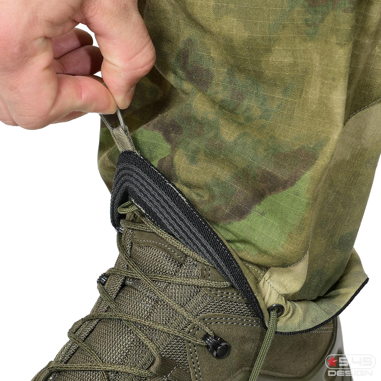 The bottom area of the pants can be adjusted to the boots volume. Moreover, the bottom is equipped with a strap that prevents the pants from lifting up